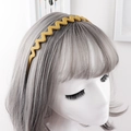 Detail of a bright mustard yellow wavy headband with matte finish on silver hair - Ginger Yellow