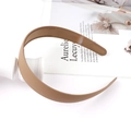 Detailed close-up of matte dark brown headband with anti-slip teeth and flexible plastic - Khaki