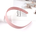 Close-up of pink matte headband with non-slip inner teeth on a white background - Girl Pink