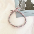 Close-up of pink and grey braided elastic hair tie on vintage aesthetic background - Pink Gray