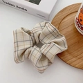 Plaid pattern fabric scrunchie in beige with minimalist grid design and fabric texture - Beige