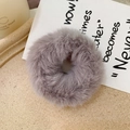 Close-up of soft grey faux rabbit fur scrunchie with fluffy texture and elastic band - Light Gray