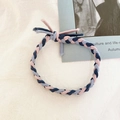Detail of hand-woven braided hair tie with pink, navy, and grey elastic ribbon knot - Navy Pink