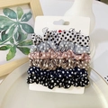 Close-up of a 6-piece polka dot satin scrunchie set displayed on a white Sweet Girl card - Polka Dot Style
