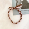 Detailed view of hand-woven braided hair tie in brown, pink, and taupe color mix - Pink Coffee Gray