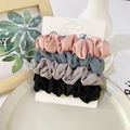 Set of 4 elegant satin scrunchies in Morandi colors displayed on a stylish tray - Pink Blue Gray Black