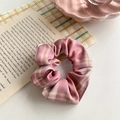 Close-up of pink plaid oversized scrunchie hair tie with soft fabric texture and check pattern - Pink Yellow Plaid