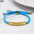 Adjustable bright blue woven rope bracelet featuring a polished gold stainless steel bar - Light Blue Rope / Gold Metal