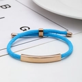 Sky blue braided rope bracelet with a rose gold metal plate and adjustable slider - Light Blue Rope / Rose Gold Metal