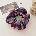 Detail of vintage knit scrunchie with herringbone texture in red and blue colors - Red and Blue Series