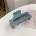 Close-up of matte blue rectangular hair claw clip for elegant long hair styling - Haze Blue