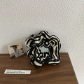 Detailed view of large zebra striped scrunchie with soft fabric texture and pleated design - Zebra Black