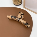 Macro shot of large tortoise shell acetate hair claw clip with elegant leopard pattern - Light Leopard
