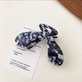 Detail view of large marble texture acetate hair claw clip with elegant blue and white patterns - Blue Series