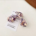 Close-up of elegant acetate hair claws with purple marble texture for long hair - Light Purple Series