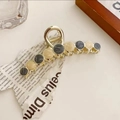 Dettaglio di elegante pinza per capelli dorata con finitura marmorizzata nera e beige - Grigio Blu-11cm
