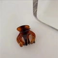 Detailed view of amber tortoise shell hair claw clip on white surface with clean aesthetics - C3.5 Hawksbill Turtle (small Three-clawed)