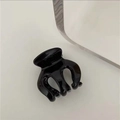 Macro detail of glossy black hair claw clip featuring a wave-shaped multi-claw design - C3.5 Black (small Three-prong)