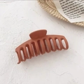 Close-up of large matte brick red hair claw clip on an aesthetic textured background - Matte Orange Keel Clip
