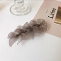 Detail of multi-layered coffee grey organza bow hair clip with translucent texture - Gray