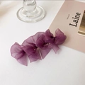 Detail view of a layered purple organza bow hair clip on a minimalist white background - Purple