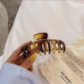 Detail of a large amber tortoiseshell hair claw clip with strong metal spring for thick hair - Gradient Light Amber Keel Clip