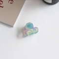 Macro shot of iridescent heart-shaped acetate hair claw clip with cutout design - Heart Shape (Dazzling Gradient)