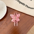 Detail of pink and white marble butterfly hair claw clip on a stylish wooden tabletop - Butterfly Claw / Pink