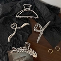 Set of four silver metal hair claws in geometric, heart, and fishbone designs - Mixed Colors