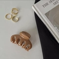 Glossy brown French hair claw clip paired with golden alloy ear cuffs on elegant background - Coffee