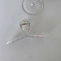 Iridescent laser-finish transparent hair claw clip with golden spring on white background - Cross-shaped Medium - 11cm