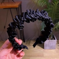 Detail of black ruffled headband with ribbed texture and elegant wavy edge design - Black