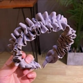 Detail of purple pleated fabric hairband with vertical texture and elegant design - Gray