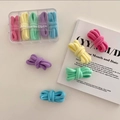 Set of 25 colorful macaron elastic hair ties in a clear storage box labeled Always be Girl - Macaron Series