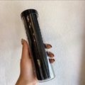 Bote de 20 gomas de pelo negras de tela elástica para mujer en un cilindro transparente - Negro