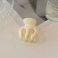 Matte cream hair claw clip for high ponytail styling with sandalwood prop background - Beige