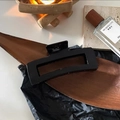 Detailed view of a 12.5cm large black matte hair claw clip on a stylish wooden tray - Large Square Black Claw Clip approx 12.5cm