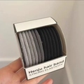 Elastic hair band set in black and grey colors displayed on a white paper card - Diagonal Pattern