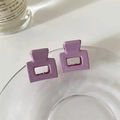Detail of two lavender Morandi matte hair claws on a glass tray for stylish hair styling - Lilac Purple