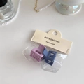 Detailed view of matte lavender and navy blue mini hair claws in handmade packaging - Purple + Blue