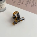 Detail of tortoiseshell acetate hair claw clip with Barrette la France white text - Tortoise