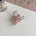 Close-up of a marble-textured acetate hair claw with pink and purple swirl patterns - Mixed Colors