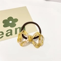 Minimalist beige acetate bow hair tie with brown elastic band for ponytail styling - Yellow Pattern