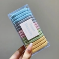 Macro detail of multi-color high elasticity hair bands set in a clear plastic storage box - 11# Morandi Colors