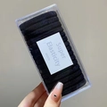Detailed view of high-elasticity black hair ties neatly organized in a clear plastic box - 8# Black