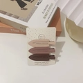 Three matte bullet-shaped hair clips in earthy tones on display cardboard - No-Crease Hair Clips