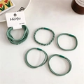 Detail of 5-piece forest green twisted elastic hair bands set on a display card - Dark Green Series