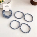 Detail view of blue Morandi style twisted elastic hair bands on branded display card - Blue Series