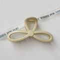 Detailed top view of cream minimalist hair claw clip with elegant triple loop design - Glossy Cream White
