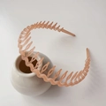 Pink wavy plastic headband with teeth design for non-slip hair styling and facial care - Jelly Frosted Orange
